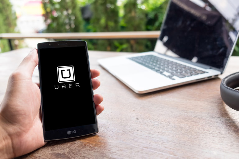 uber on cell phone logo - PayReel