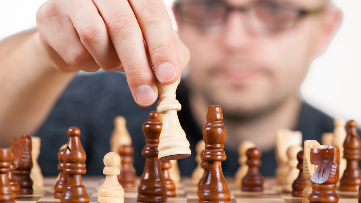 man playing chess - PayReel