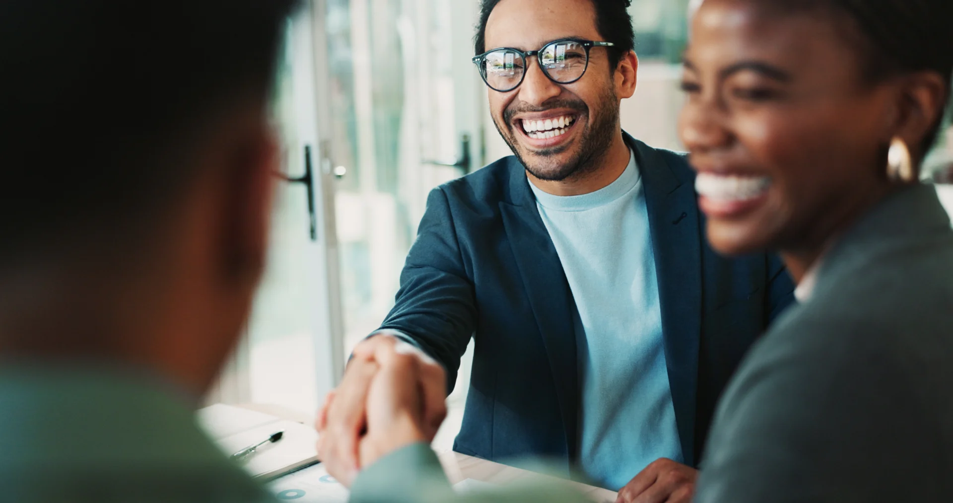 A man and woman smiling representing people and processes.